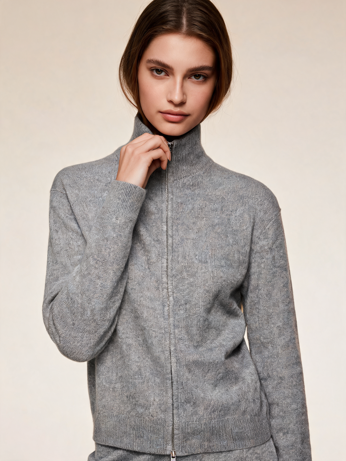 Grey cardigan, close-up of zip and high neck