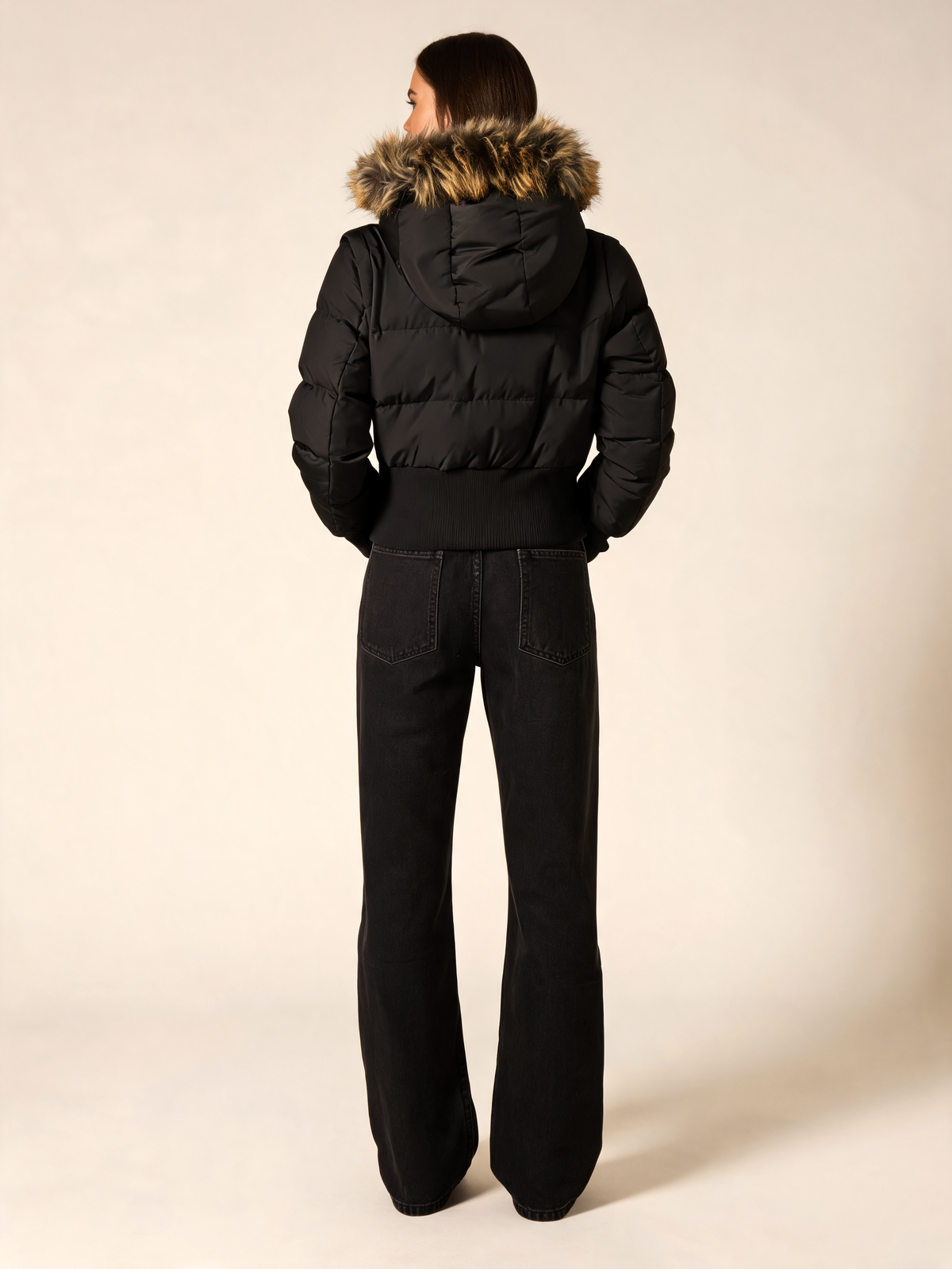 Black puffer jacket women back view