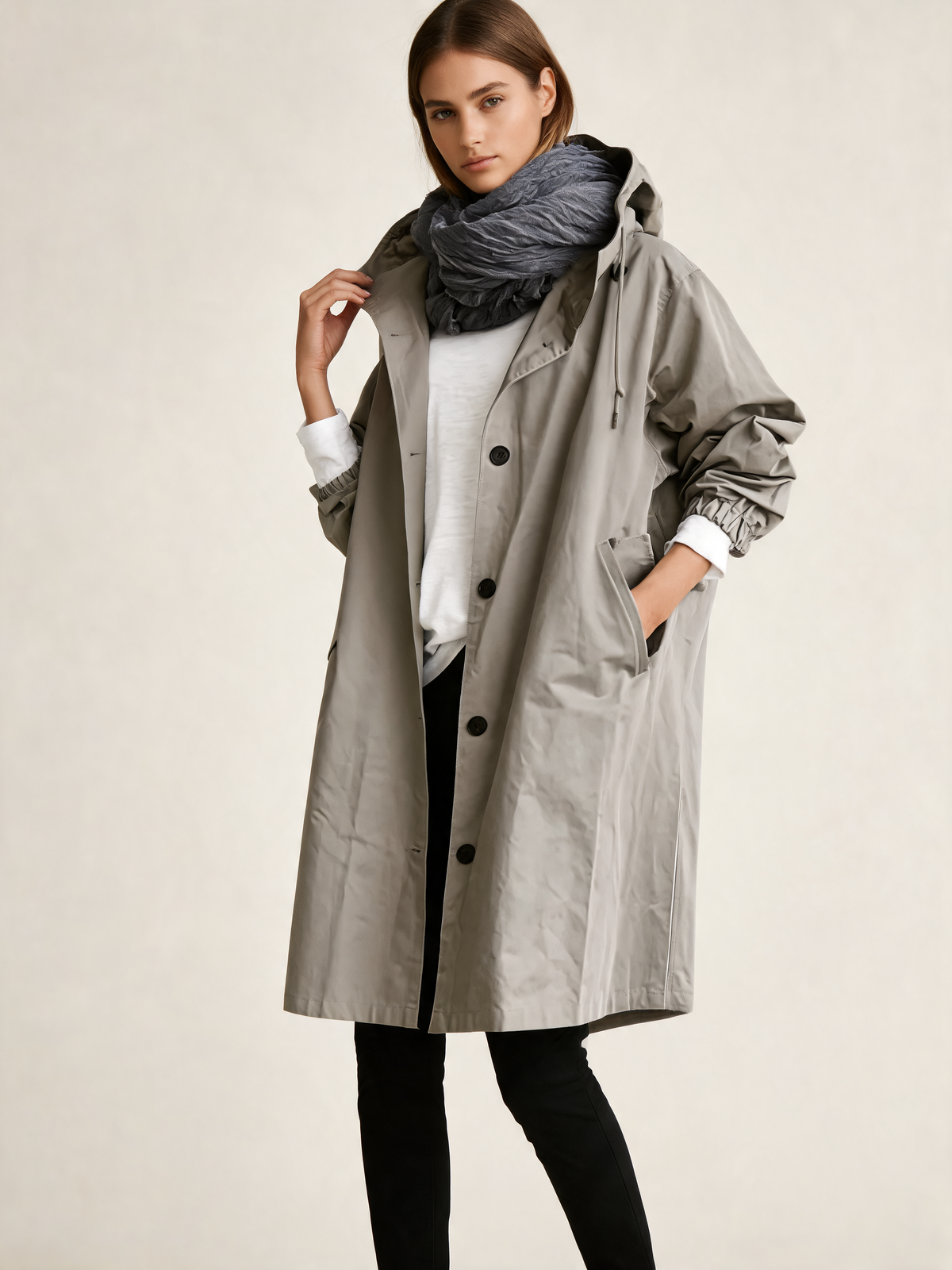 Grey trench coat three-quarter view