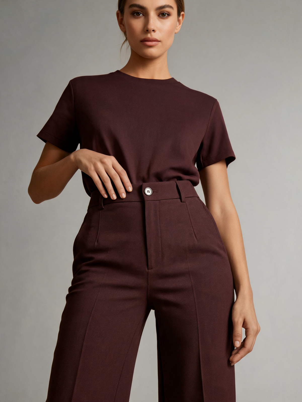 Burgundy wide leg trousers close-up