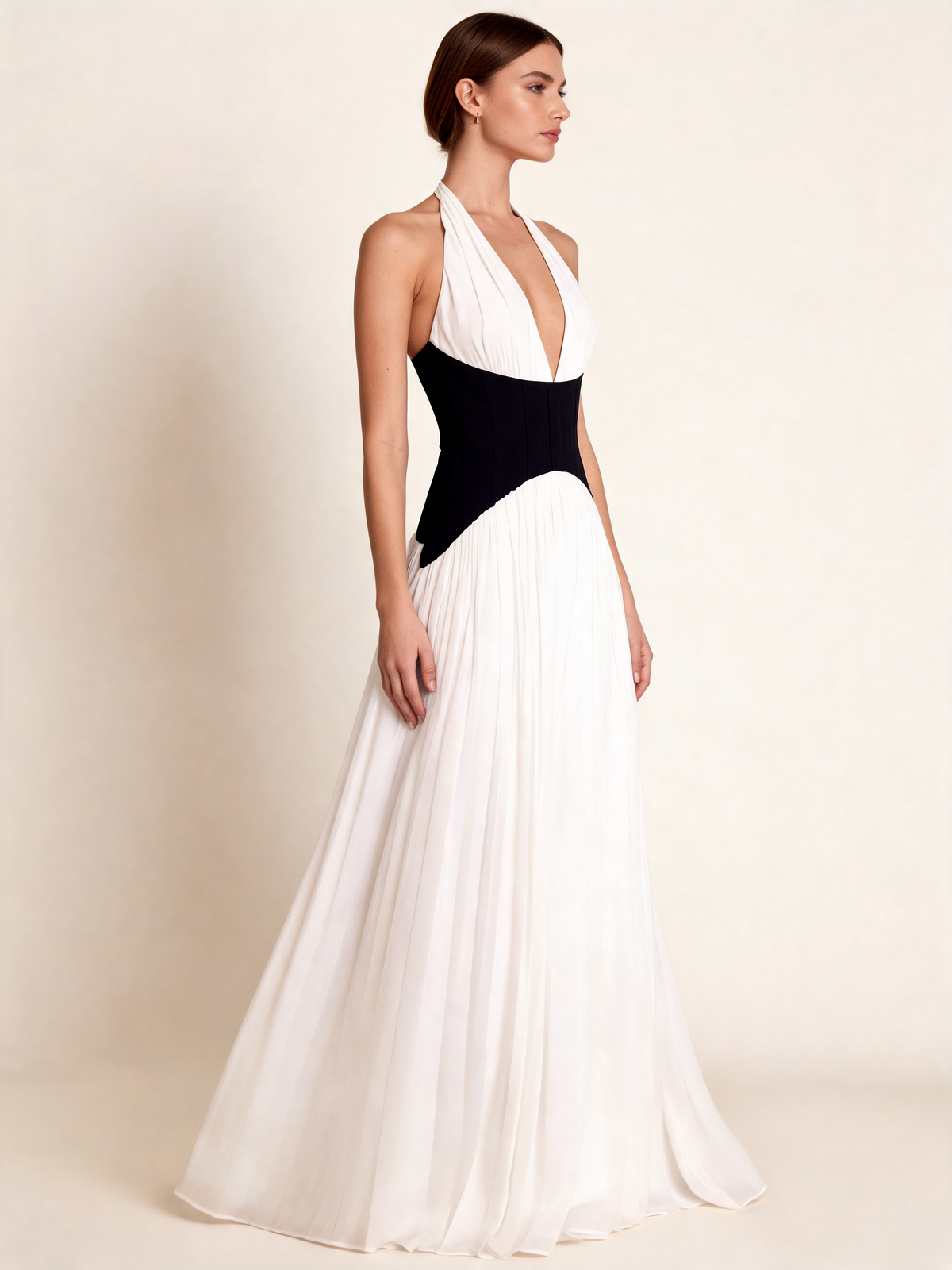 White halterneck party dress with black waist, side view