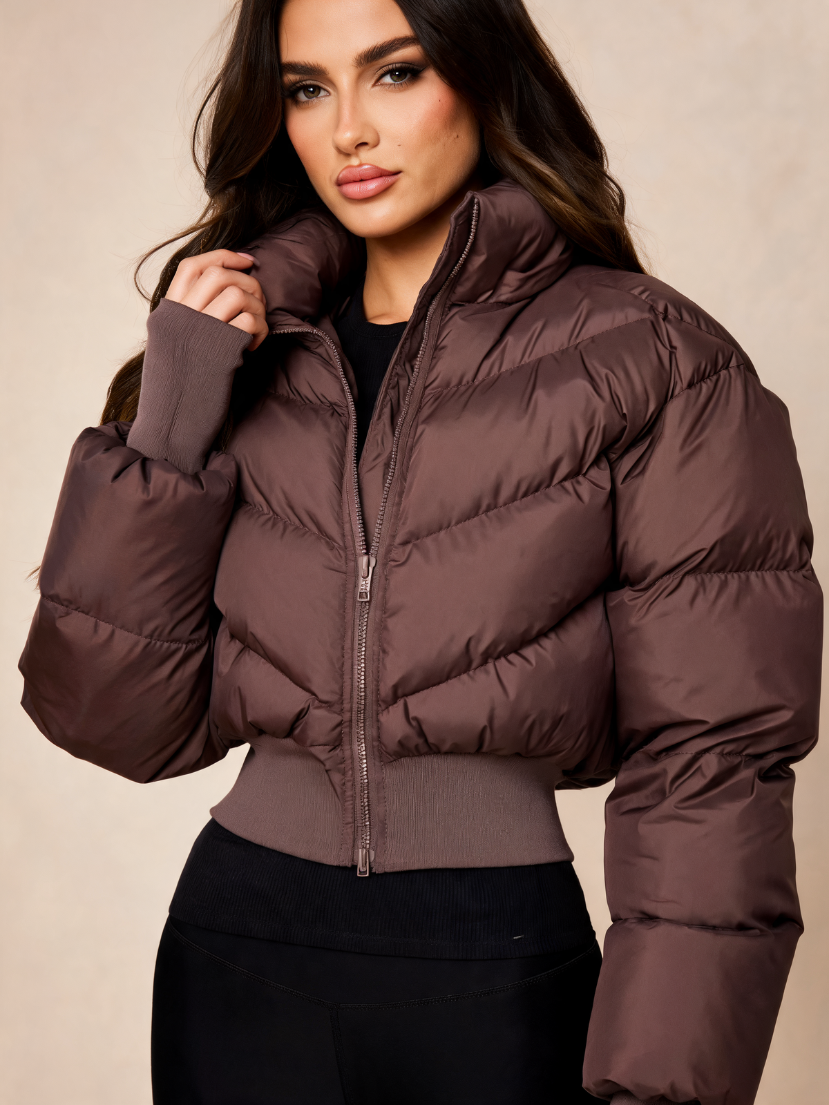 Chocolate brown puffer jacket women close-up of collar and quilting
