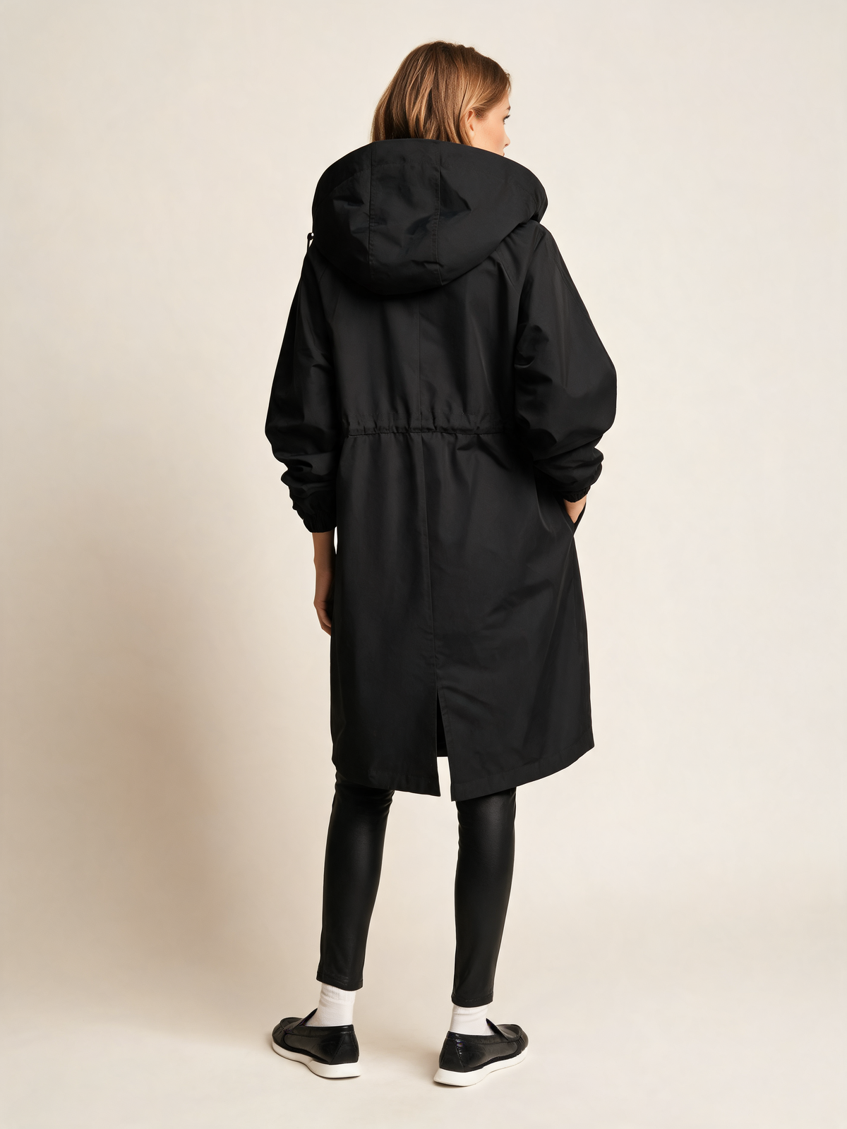 Black trench coat back view