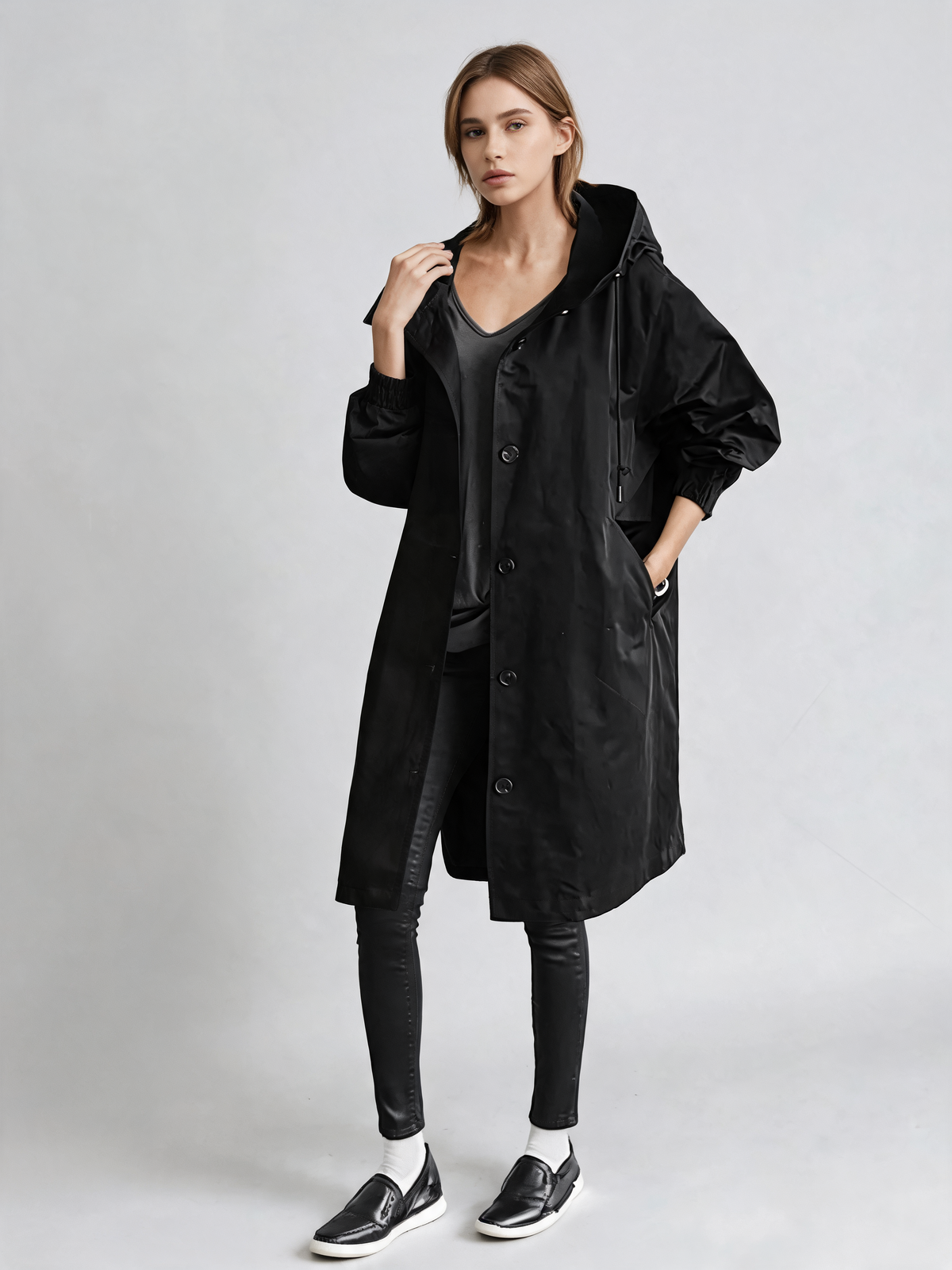 Black trench coat three-quarter view