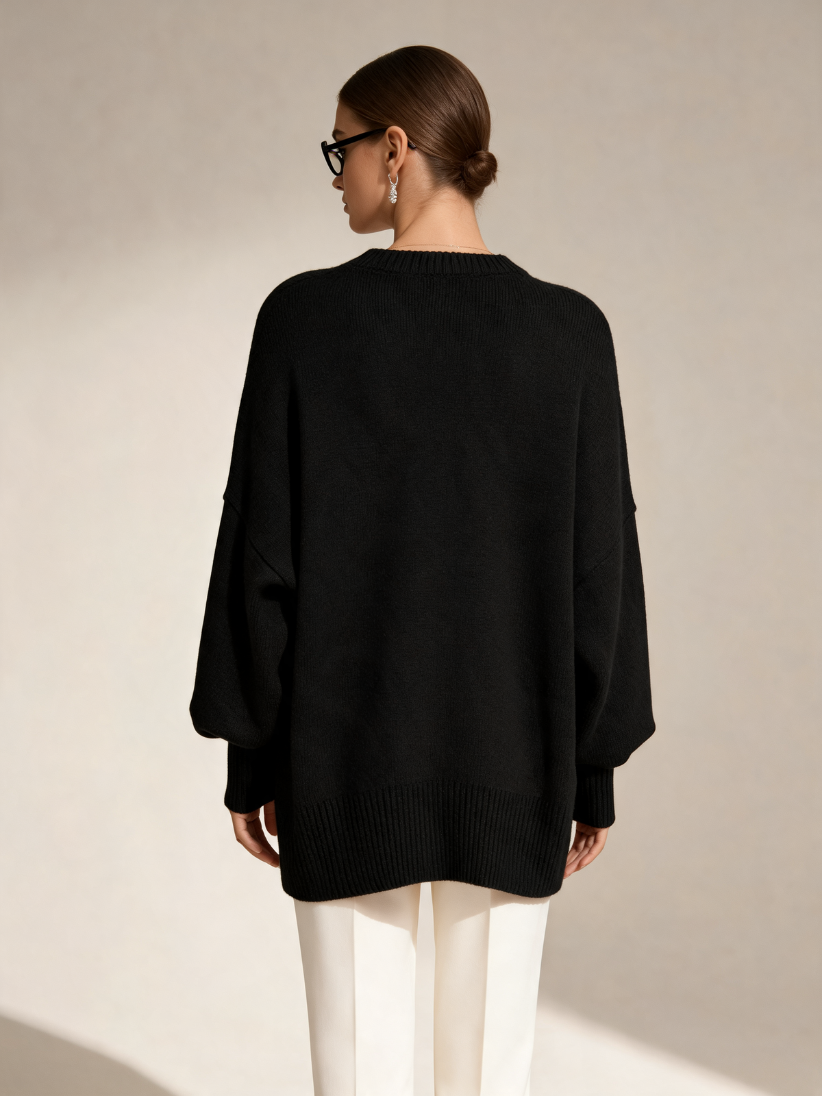 Black women's jumper back view