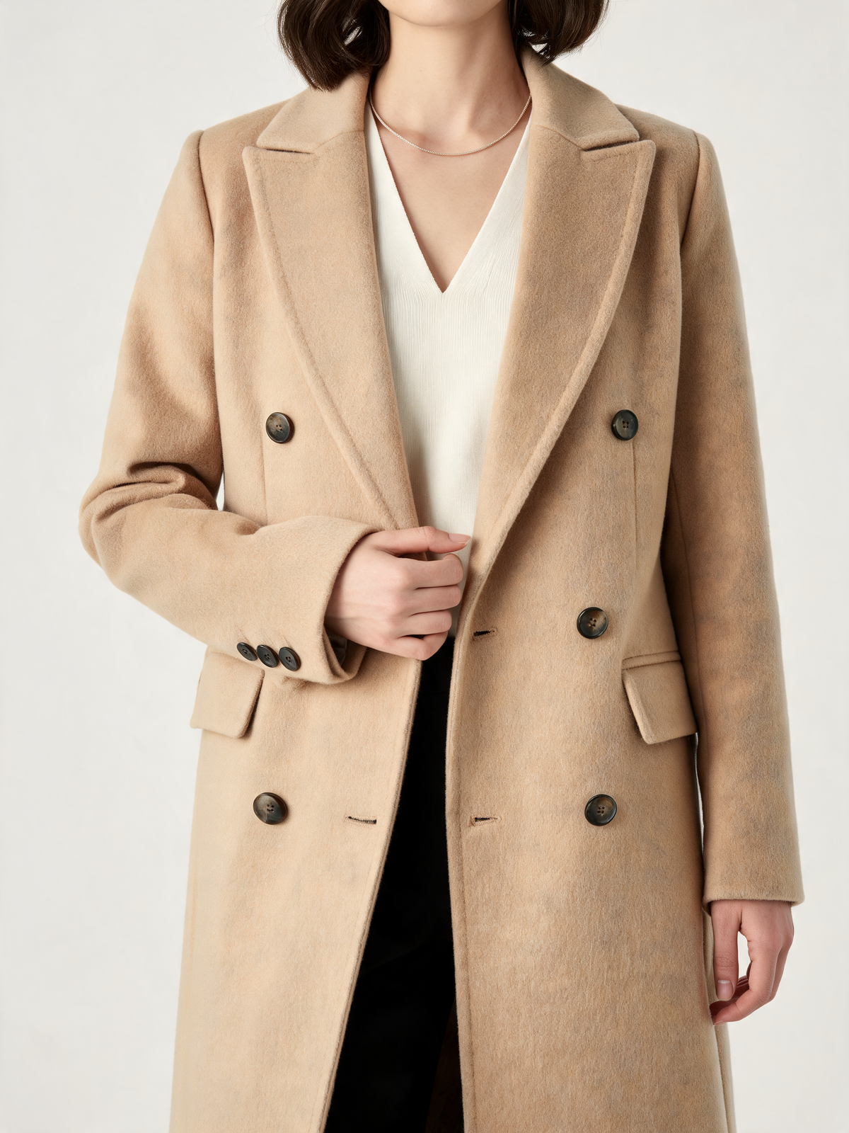 Beige longline coat – close-up of lapels and buttons